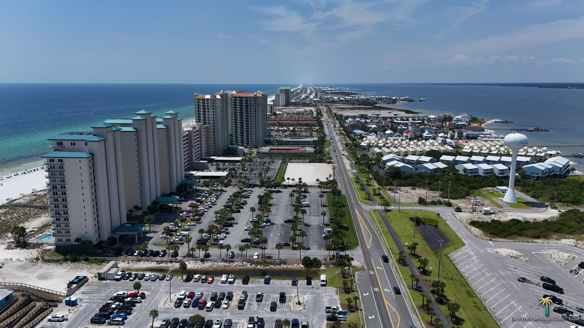 Aerial view looking east along Santa Rosa Island from Navarre Beach, Florida with the Gulf of America and Santa Rosa Sound on either side